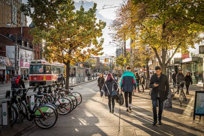 A lively Liberty Village sidewalk with neighbours out and about